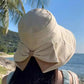 👒 50% OFF NOW ! 💐 Women's Bowknot Wide Brim Sun Protective Hat – Oversized wide brim blocks UV rays, delicate bow decor, lightweight breathable fabric, ideal for beach, travel & outdoor walking✨